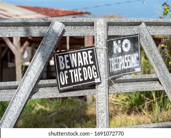 Beware Of The Dog Sign In Front Of Old House