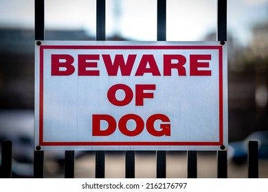 Beware Of Dog Sign On Fence