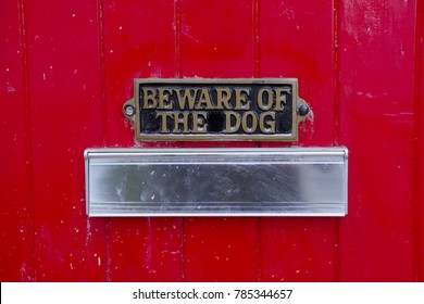 Beware Of Dog Sign On Front Gate Of House Above Letter Box