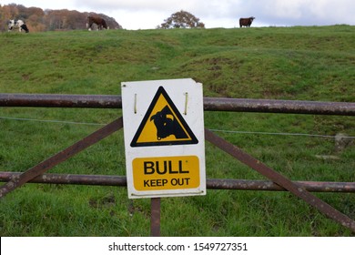 A beware warning sign on a gate which says bull keep out