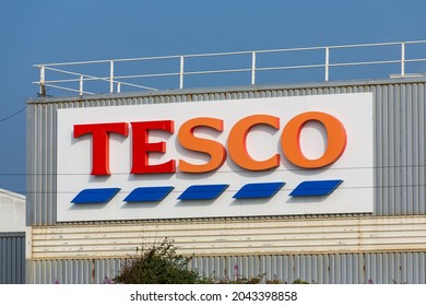 Bexhill-on-Sea, East Sussex, United Kingdom - September 5th 2021: A faded Tesco sign on the back of the Tesco store at Bexhill-on-Sea