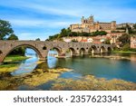 Beziers city, view of the medieval Pont Vieux bridge, the Cathedral and historical Old town on a hill over Orb river, Cathedral and bridge, Occitania, France