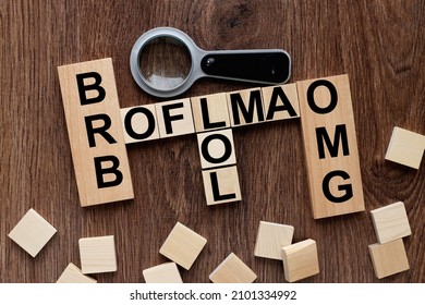 BFF, ROFL, OMG and LMAO, BRB .. abbreviated text messages on wooden cubes in the form of a crossword puzzle. Internet slang.