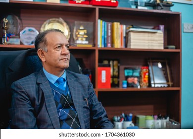 Bhaktapur, Bagmati / Nepal - 02/26/2020: Prof. Dr. Yuvraj Sangroula, Executive Director and Principal of Kathmandu School of Law College in his office.