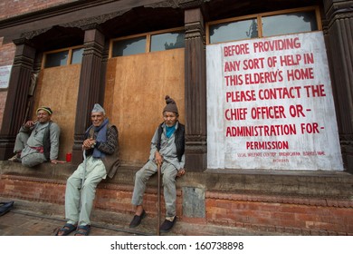 BHAKTAPUR, NEPAL, APRIL 24: Three Unidentified Elderly Men Sitting In Front Of A Social Welfare Center, Bridhashram, Pashputi In Kathmandu Nepal , 22 April 2013