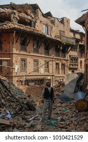 Bhaktapur, Nepal – May 05, 2015: Man Inspecting Damage In A Historic Town Bhaktapur, A Few Days After The Devastating Earthquake. 