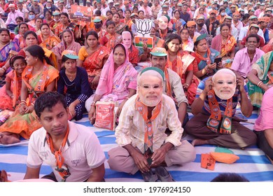 Bharatiya Janta Party Or BJP Activists Wear Narendra Modi Mask And Take Part In Amit Shah Election Campaign Rally Ahead Of State Legilative Assembly Election On March 25,2021 In Mecheda, India.