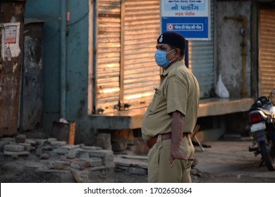 Bharuch, Gujarat / India - April 05 2020: Covid 19 Corona Virus 21 Days Lockdown In India. Police On Duty To Stop People From Roaming In City And Make Them Follow Lockdown To Prevent Spread Of Corona.