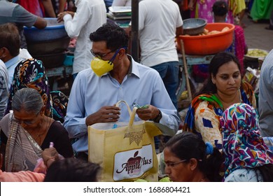 Bharuch, Gujarat / India - June 1, 2020: Unlock 1.0. An Indian Man And Woman Wearing MEDICAL MASK For Protection, Safety, Prevention Of COVID 19 CORONA VIRUS Buying Vegetables Fruit In Market Crowd.