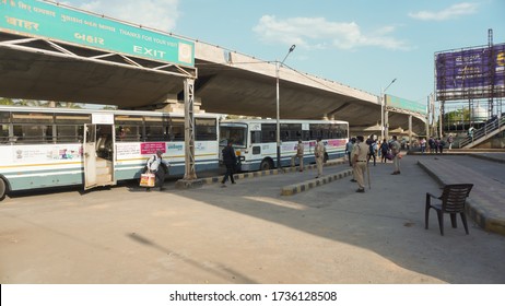 Bharuch, Gujarat / India: May 20, 2020: Indian Migrant Workers Affected Due To COVID 19 Corona Virus Nationwide Lockdown. Migrant Workers Returning Back Home Special Trains Bus Police Railway Station.