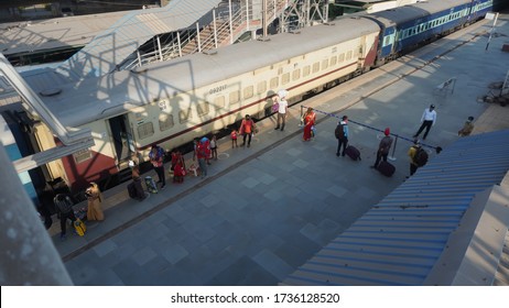 Bharuch, Gujarat / India: May 20, 2020: Indian Migrant Workers Affected Due To COVID 19 Corona Virus Nationwide Lockdown. Migrant Workers Returning Back Home Special Trains Bus Police Railway Station.