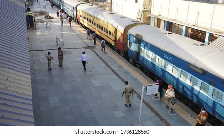 Bharuch, Gujarat / India: May 20, 2020: Indian Migrant Workers Affected Due To COVID 19 Corona Virus Nationwide Lockdown. Migrant Workers Returning Back Home Special Trains Bus Police Railway Station.