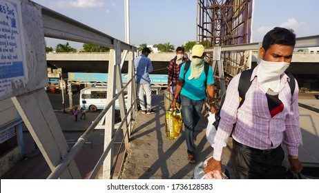 Bharuch, Gujarat / India: May 20, 2020: Indian Migrant Workers Affected Due To COVID 19 Corona Virus Nationwide Lockdown. Migrant Workers Returning Back Home Special Trains Bus Police Railway Station.