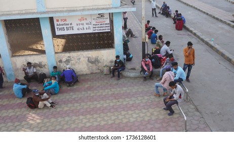 Bharuch, Gujarat / India: May 20, 2020: Indian Migrant Workers Affected Due To COVID 19 Corona Virus Nationwide Lockdown. Migrant Workers Returning Back Home Special Trains Bus Police Railway Station.