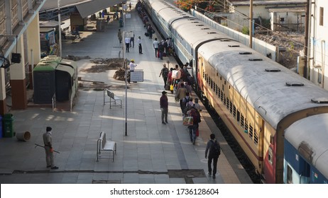 Bharuch, Gujarat / India: May 20, 2020: Indian Migrant Workers Affected Due To COVID 19 Corona Virus Nationwide Lockdown. Migrant Workers Returning Back Home Special Trains Bus Police Railway Station.