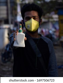 Bharuch, Gujarat/India - March 20, 2020: A Man Wearing CORONA VIRUS MEDICAL MASK For The Prevention Of COVID-19 CORONA VIRUS While Having Handwash In Hand. Selective Focus On Man And Background Blur.