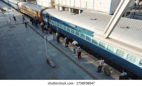 Bharuch,Gujarat/ India- May 20,2020: Migrant Workers Train In Queue To Home. Due To COVID 19 Corona Virus  Lock Down People Travel. Policemen Take Protection And Social Distancing. Railway. Wear Mask.