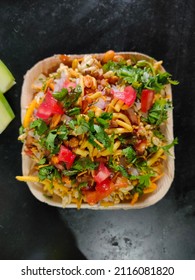 Bhelpuri Is A Savoury Snack Originating From India, And Is Also A Type Of Chaat. It Is Made Of Puffed Rice, Vegetables And A Tangy Tamarind Sauce, And Has A Crunchy Texture. 