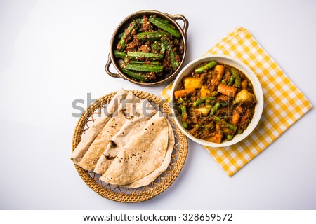 Bhindi masala or ladies finger fry and Mixed veg in red hot curry served with indian roti / chapati or Indian Flat bread