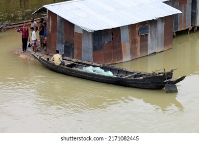 Bholaganj, Bangladesh- June 23, 2022:Villages and markets of the low-lying areas have been flooded due to the overflowing of water and heavy rainfalls.Global warming and climate change is main issue.