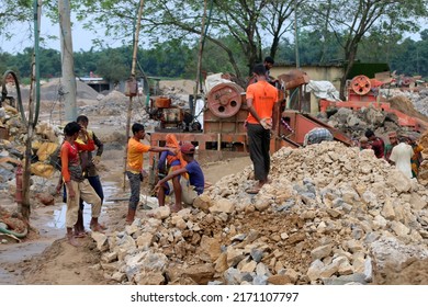 Bholaganj, Bangladesh- June 24, 2022: Bangladeshi Labour or worker are working in stone crusher Machine to break stone at Bholaganj, sylhet, Bangladesh.