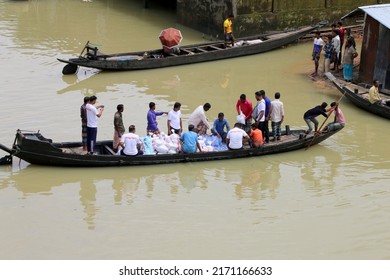 Bholaganj, Bangladesh- June 24, 2022: Relief food and other items are supplied to flooded areas or villages at sylhet city, Bangladesh.