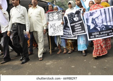 BHOPAL- DECEMBER 2: Activists Walk With Posters Of Warren Anderson During The Rally To Mark The 26th Year Of The Bhopal Gas Disaster , In Bhopal - India On December 2, 2010.