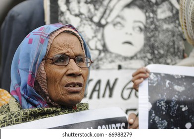 BHOPAL- DECEMBER 2: An old woman in front of the most iconic image of Bhopal Disaster during the rally to mark the 26th year of the Bhopal Gas Disaster, in Bhopal - India on December 2, 2010.