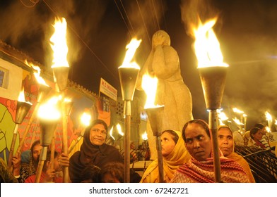 BHOPAL- DECEMBER 2: Protesters and victims gather around the "Bhopal Mother Statue" during the torch rally to  mark the 26th year of Bhopal gas disaster, in Bhopal - India on December 2, 2010.