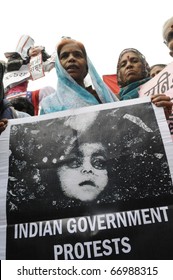 BHOPAL- DECEMBER 2: Victims hold an image of a deceased child from  1984 during the rally to mark the 26th year of the Bhopal Gas Disaster, in Bhopal - India on December 2, 2010.