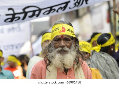 BHOPAL- DECEMBER 3 : A Hindu monk walks with the marchers during the rally to mark the 26th year of the Bhopal Gas Disaster, in Bhopal - India on December 3, 2010.