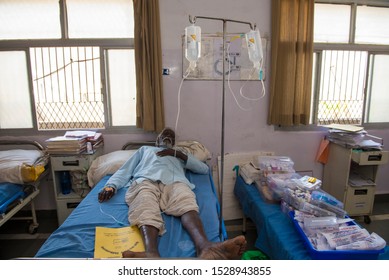 Bhopal / India 12 March 2019 Indian Rural  Man Patient With Medical Drip Or IV Drip Lying On Hospital Bed  In Ward At Bhopal Madhya Pradesh Central India