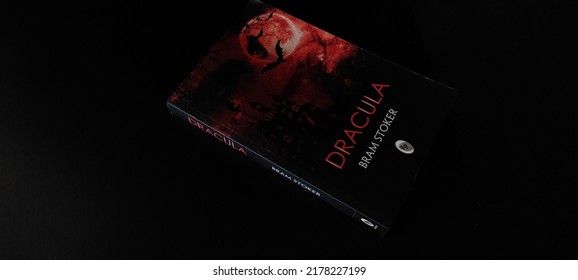Bhopal, India- July 14 2022: An epistolary Gothic novel, Dracula by author Bram Stoker on black wooden table and dark background.