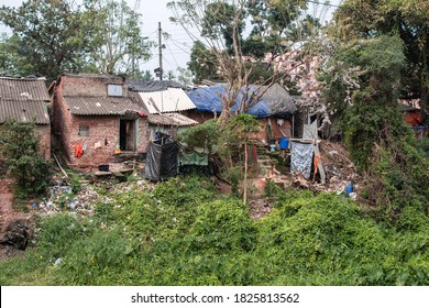 Bhubaneswar, India - February 4, 2020: Easy residential homes with plastic waste and laundry drying in the slums on February 4, 2020 in Bhubaneswar, India