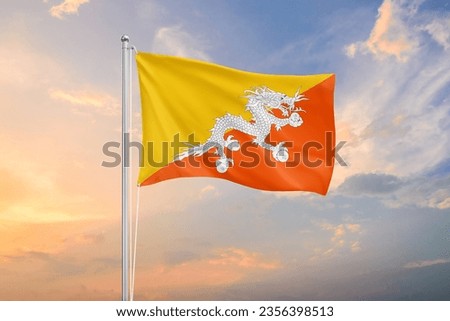 Bhutan flag waving on sundown sky