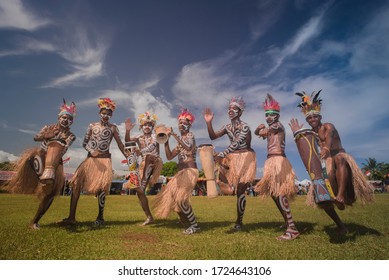 Biak, Papua-Indonesia, pose for one of the dance teams, July 2, 2019