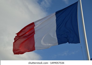 Biarritz, / France - -08 25 2019: Flag Of France Over A Blue Sky At The 45th G7 Summit In Biarritz, France