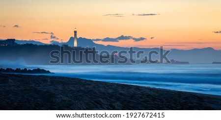 The Biarritz lighthouse at sunset,Atlantic ocean and beach in the foreground, in France