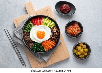  Bibimbap on a concrete background, traditional korean dish, top view