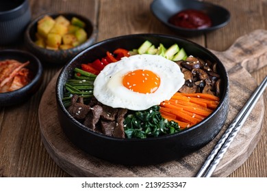  Bibimbap on a wooden background, traditional korean dish 