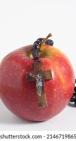 Bible Eva's Sin Red Apple over a White Background