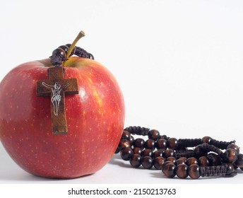 Bible Eva's Sin Red Apple over a White Background
