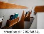 Bible and Hymnal in church pew