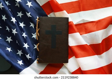 Bible On The American Flag. Religious Concept. Catholicism And Protestantism.
