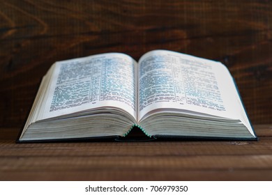 Bible on a brown wooden table. Beautiful background.Religion concept - Shutterstock ID 706979350