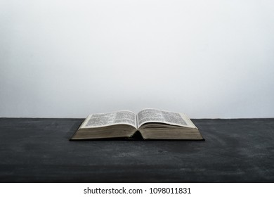 Bible on the dark table. Beautiful white background - Powered by Shutterstock