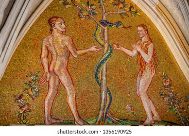 Bible scene of Genesis with Adam and Eva at major entrance portal of Saint Vitus Cathedral in Prague, Czech Republic, details, closeup