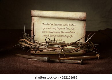 Bible Scripture with crown of thorns and nails over cloth - John 3:16
