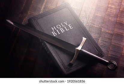 Bible and a Sword on a Dark Wooden Table - Shutterstock ID 1920561836