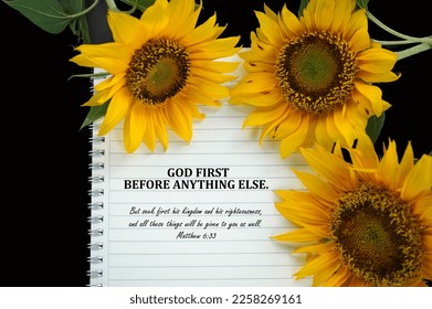 Bible verse quote - God First before anything else. Matthew 6:33 But seek first his kingdom and his righteousness, and all these things will be given to you as well. On notebook and sunflowers. - Shutterstock ID 2258269161